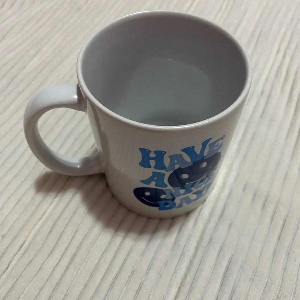 White and blue smiley face mug